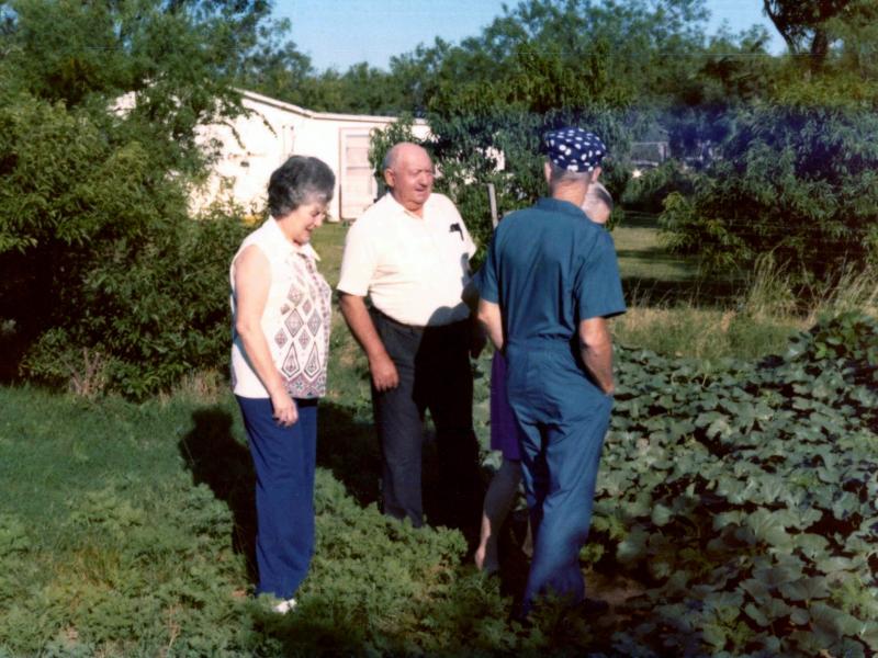 Ernest shows Ruth and Vernon his garden, July 1975